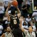 EMU J.R. Sims and Daylen Harrison contest Purdue Terone Johnson's shot in the remaining minute of the game on Saturday. EMU won 47-44. Daniel Brenner I AnnArbor.com